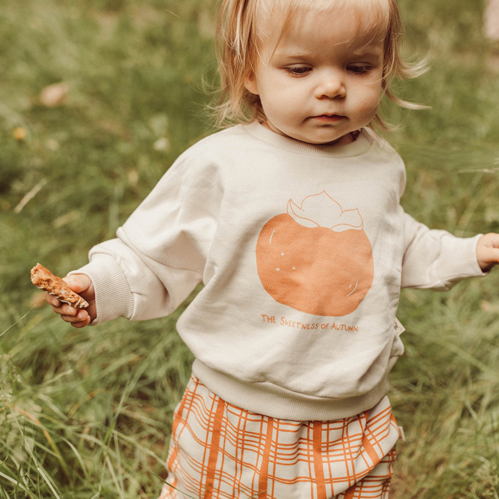 'the sweetness of autumn (plums)' white sand sweatshirt