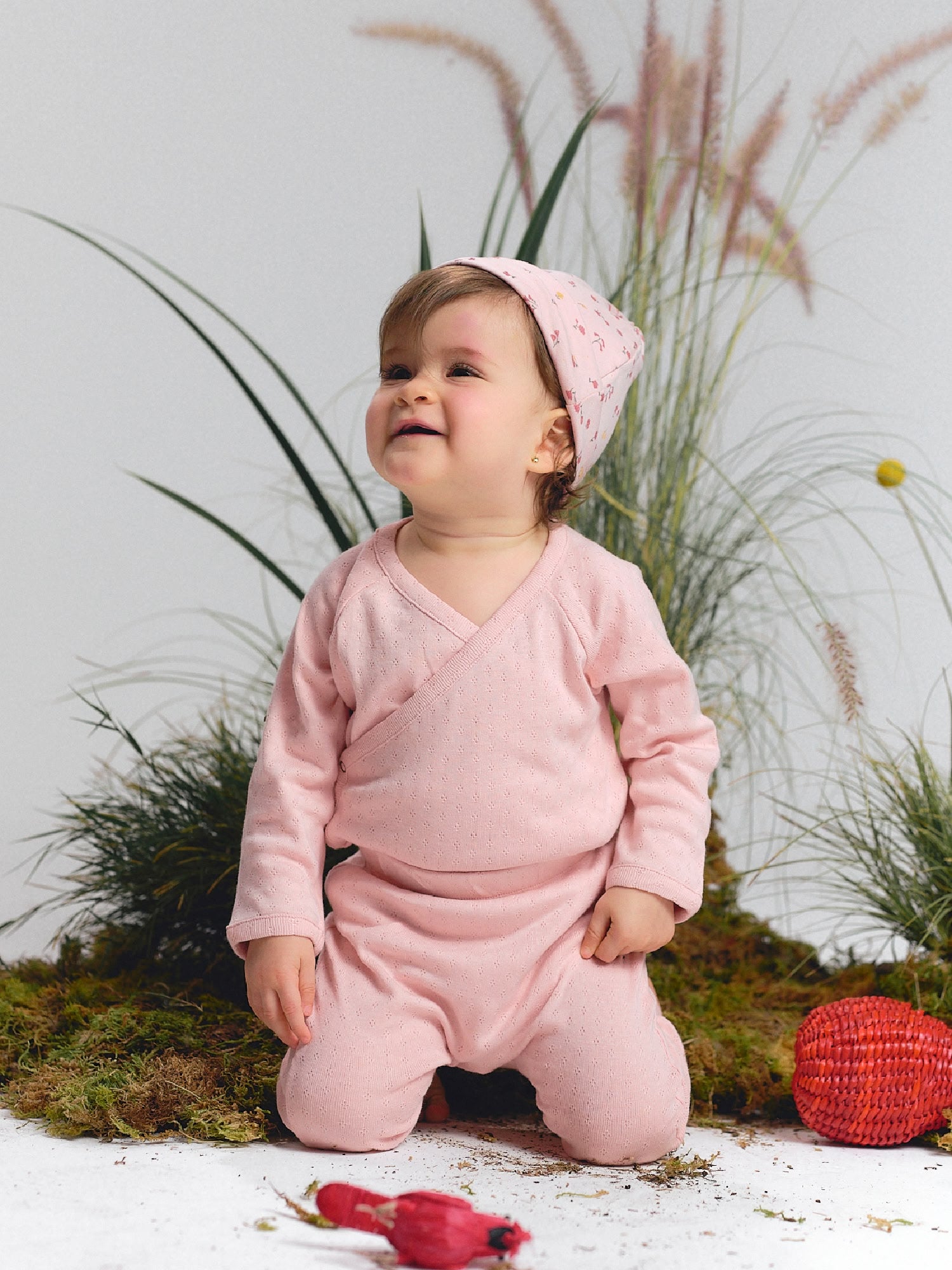 (kimono-style top and pants), with a matching pink printed headband.