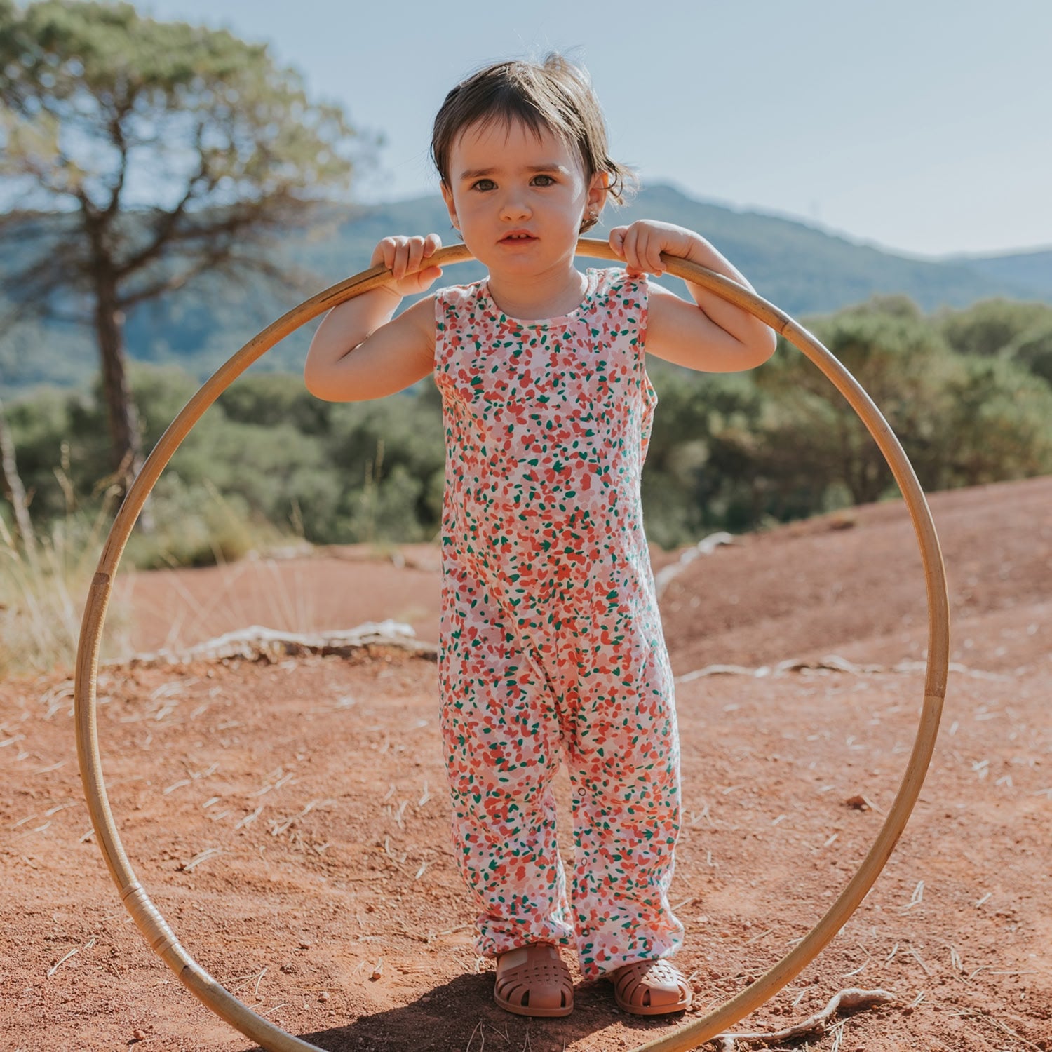 Organic cotton baby jumpsuits - Red Caribou SS25, GOTS-certified, hypoallergenic sleepers perfect for sleep and play.
