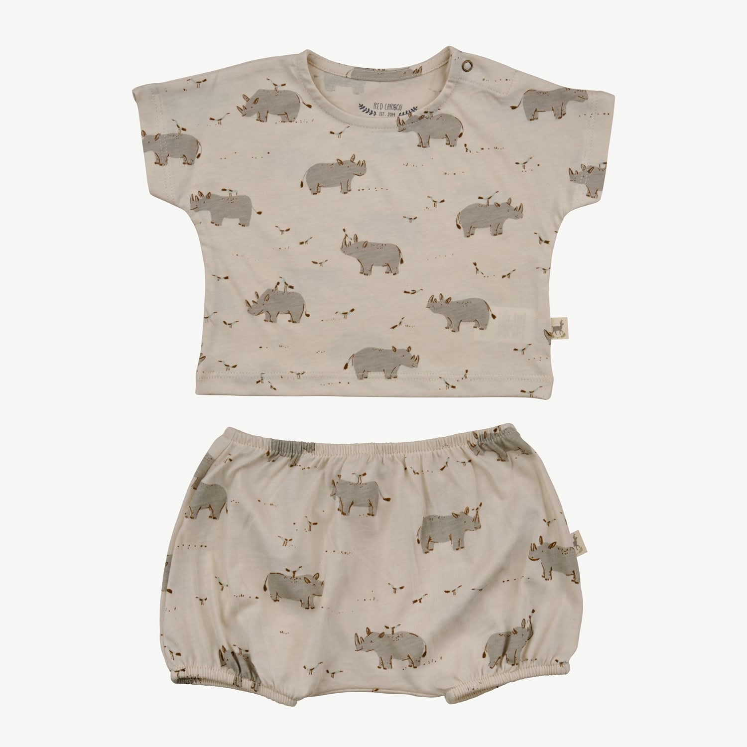 Two-piece baby set in beige with an all-over rhino and bird print, including a short-sleeve top with shoulder snaps and matching bloomers with elastic waistband and leg openings