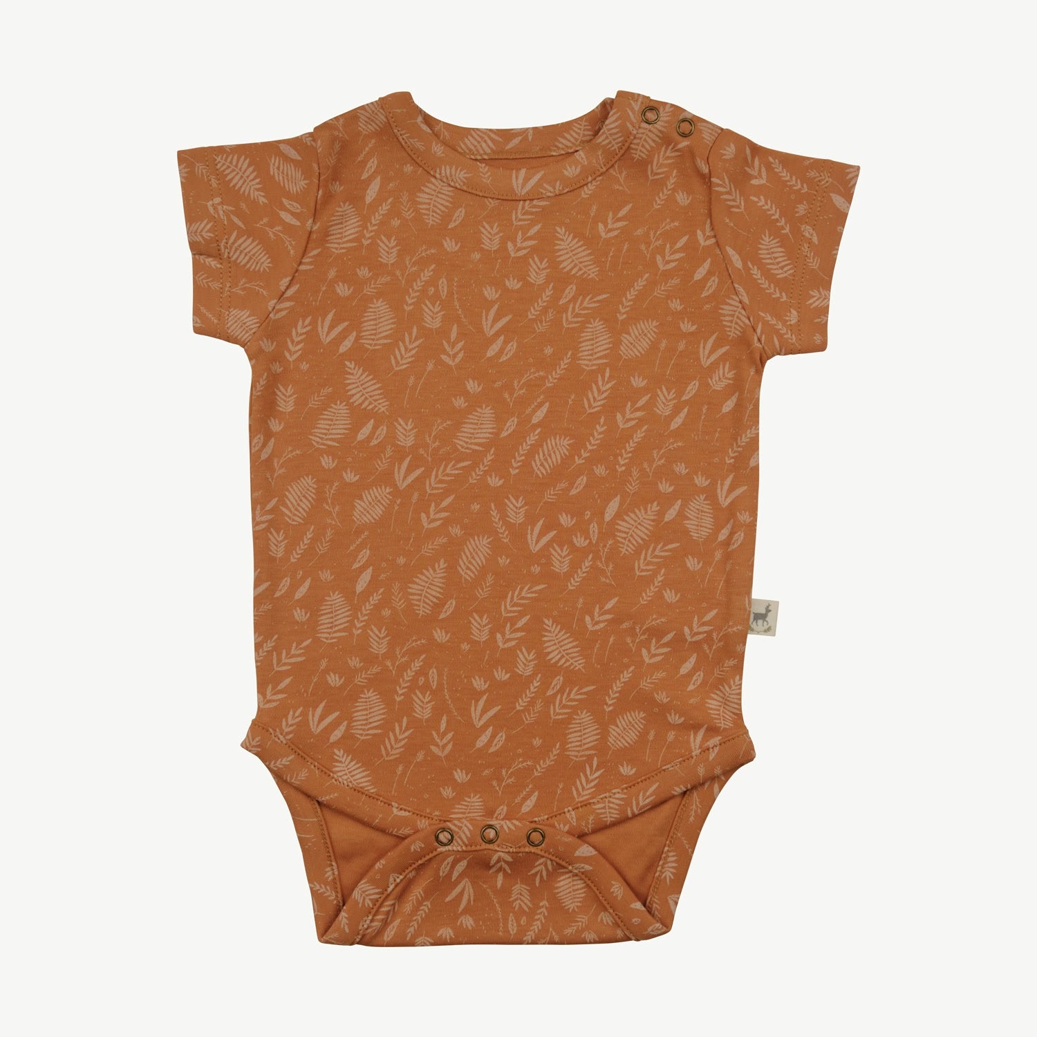 Short-sleeve baby onesie in terracotta orange with an all-over leaf print in lighter tones, featuring snap closures at the bottom and shoulder
