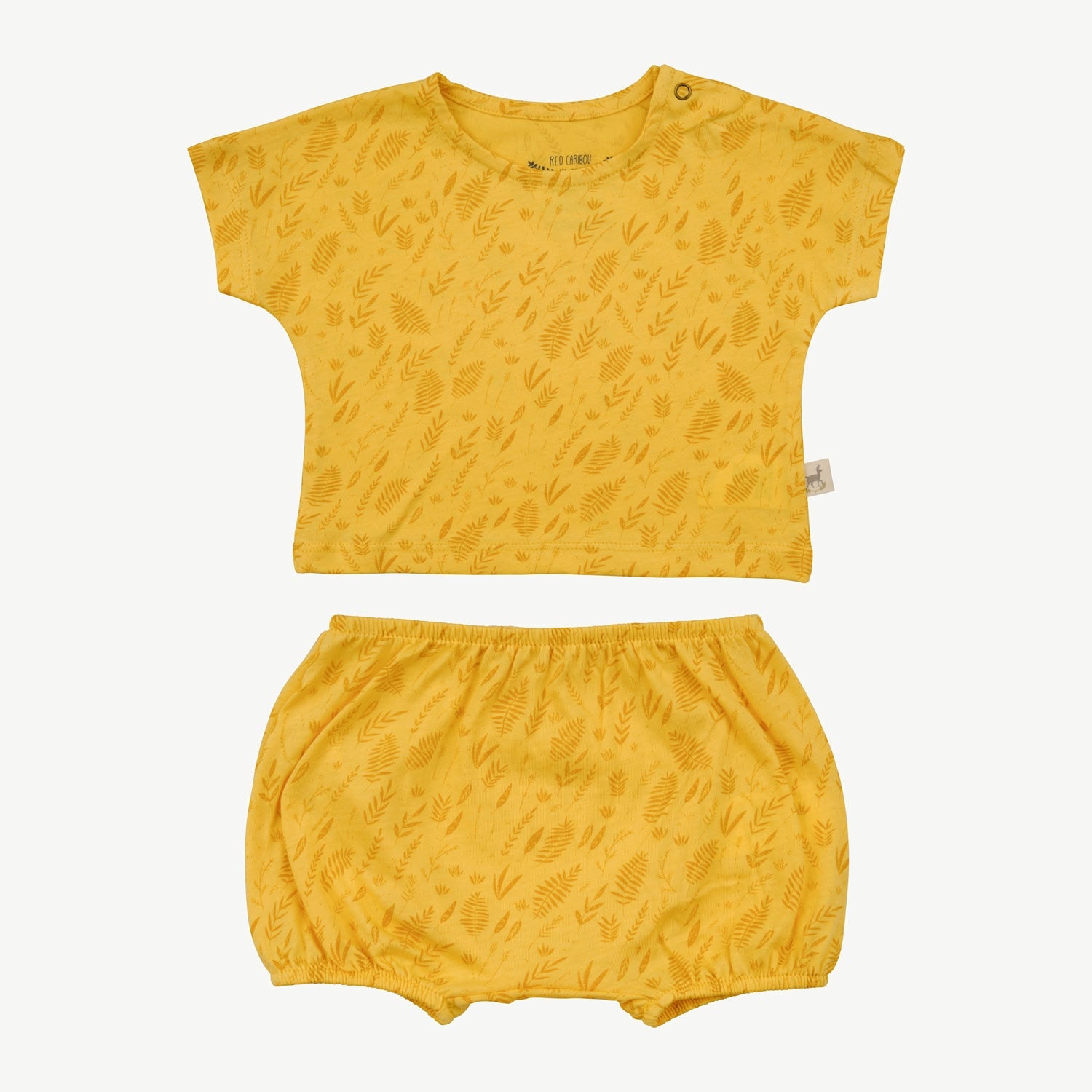 Two-piece baby set in yellow with an all-over leaf print, including a short-sleeve top with shoulder snaps and matching bloomers with elastic waistband and leg openings